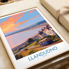 Framed Llandudno Wales travel poster with colorful sunset and tram, unwrapped as a gift.