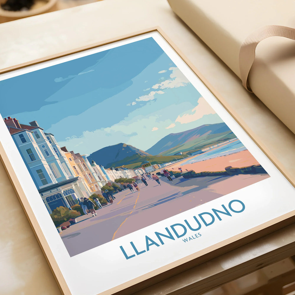Framed Llandudno Wales travel poster art print with beach promenade and Victorian buildings.