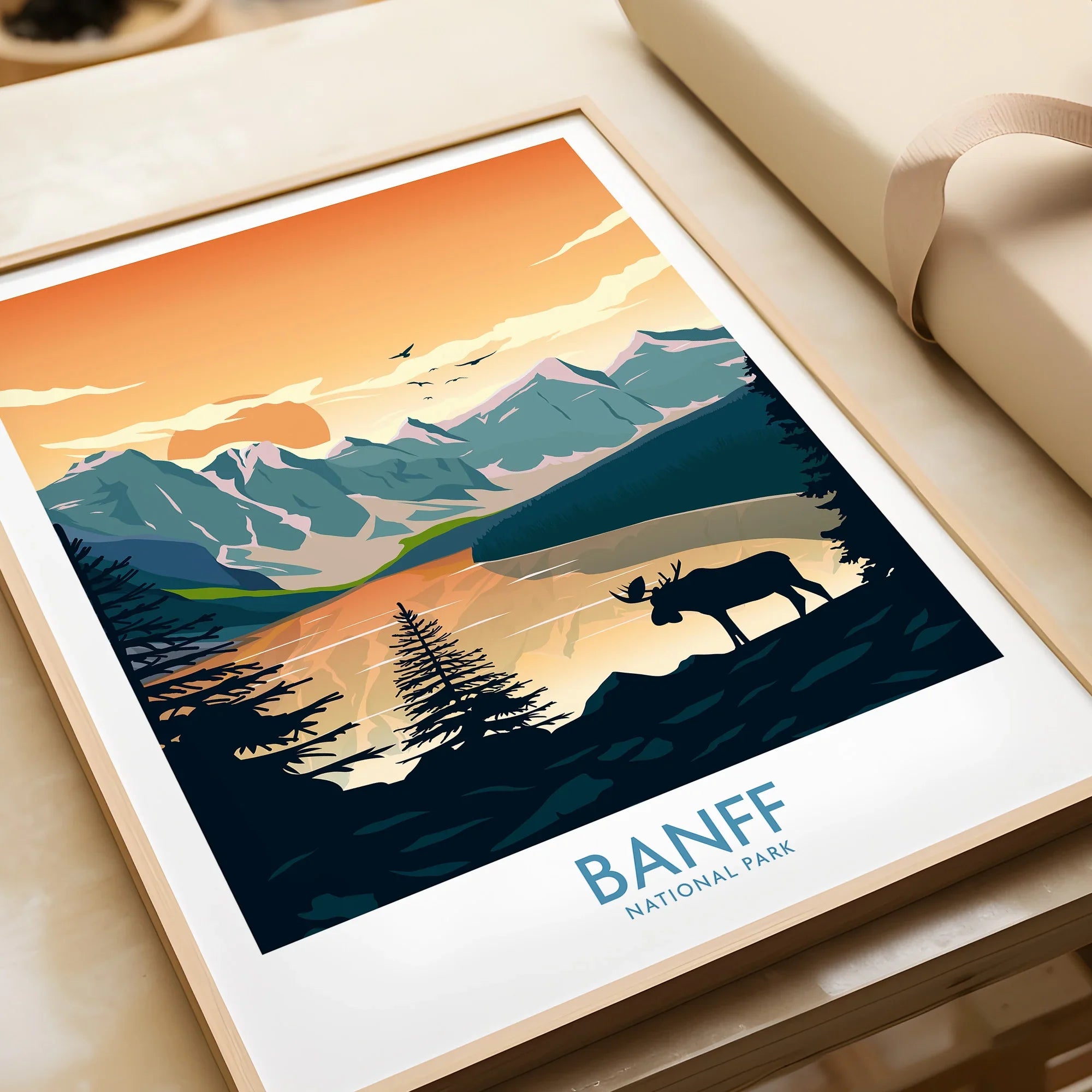 Framed Banff National Park art print with moose silhouette and mountain sunset scene