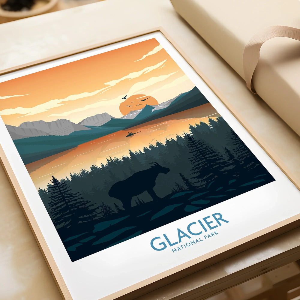 Framed Glacier National Park art print with moose silhouette, forest, and sunset, unwrapped as gift