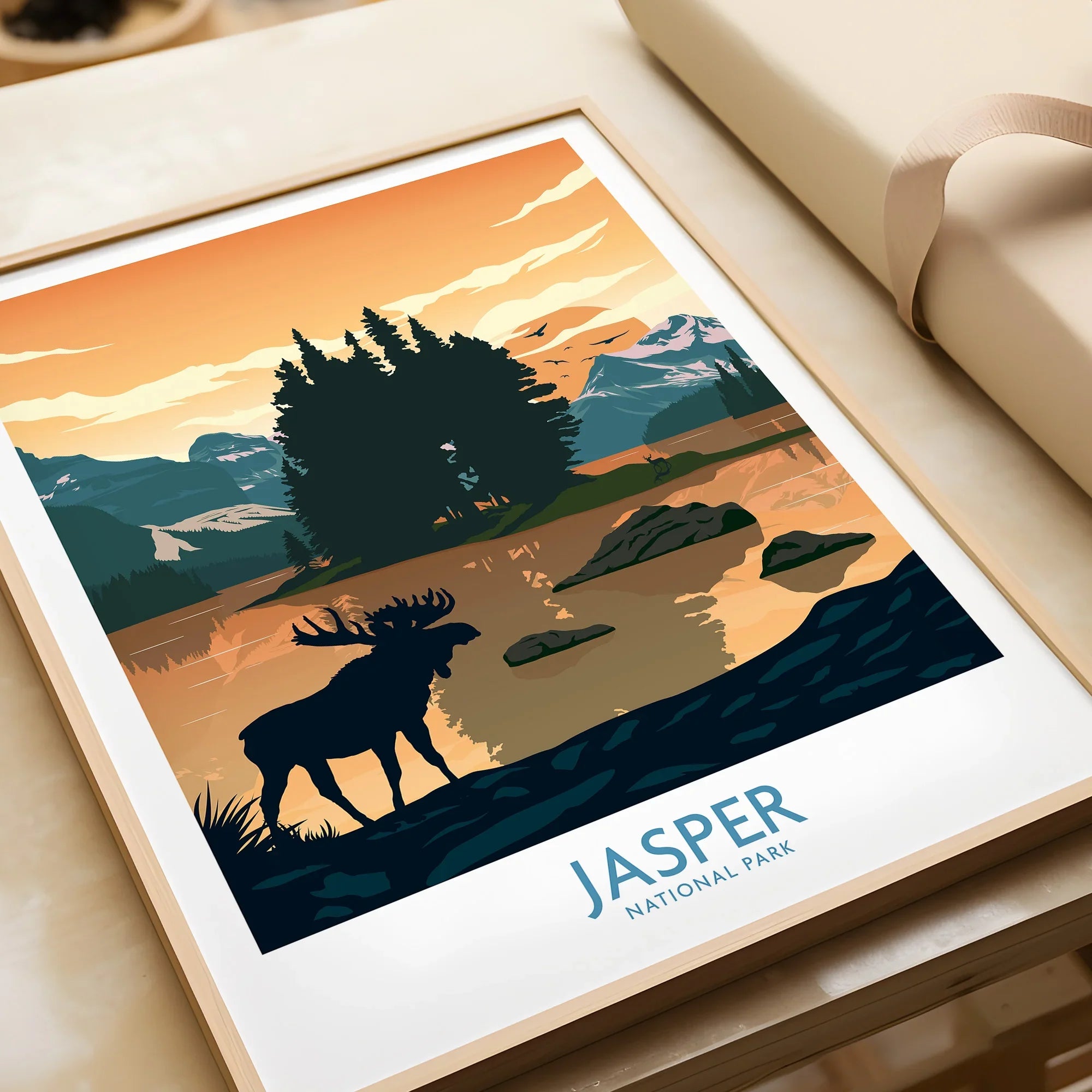 Framed Jasper National Park art print with moose, lake, and sunset landscape, unwrapped gift