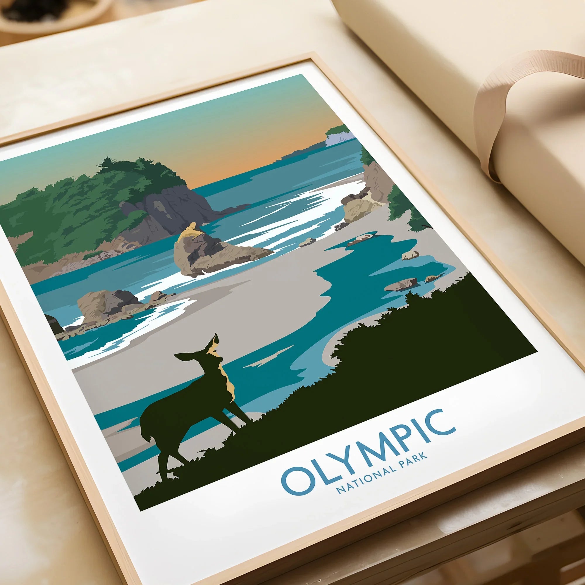 Framed Olympic National Park art print with a deer, ocean, and coastal landscape unwrapped.