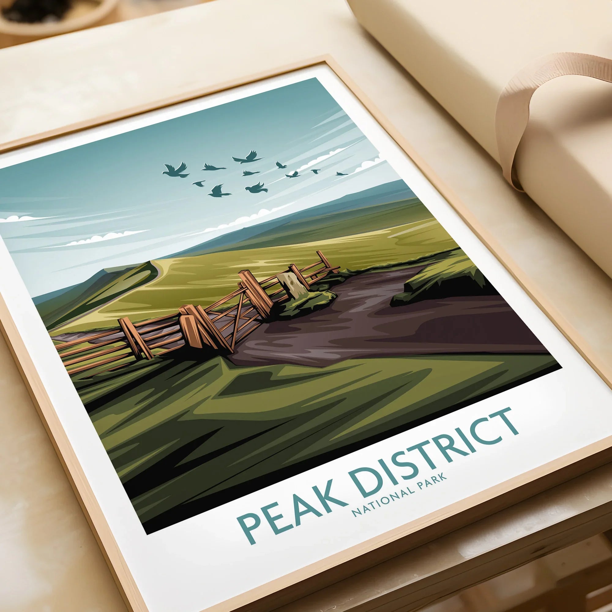 Framed Peak District National Park art print with green hills, gate, and flying birds