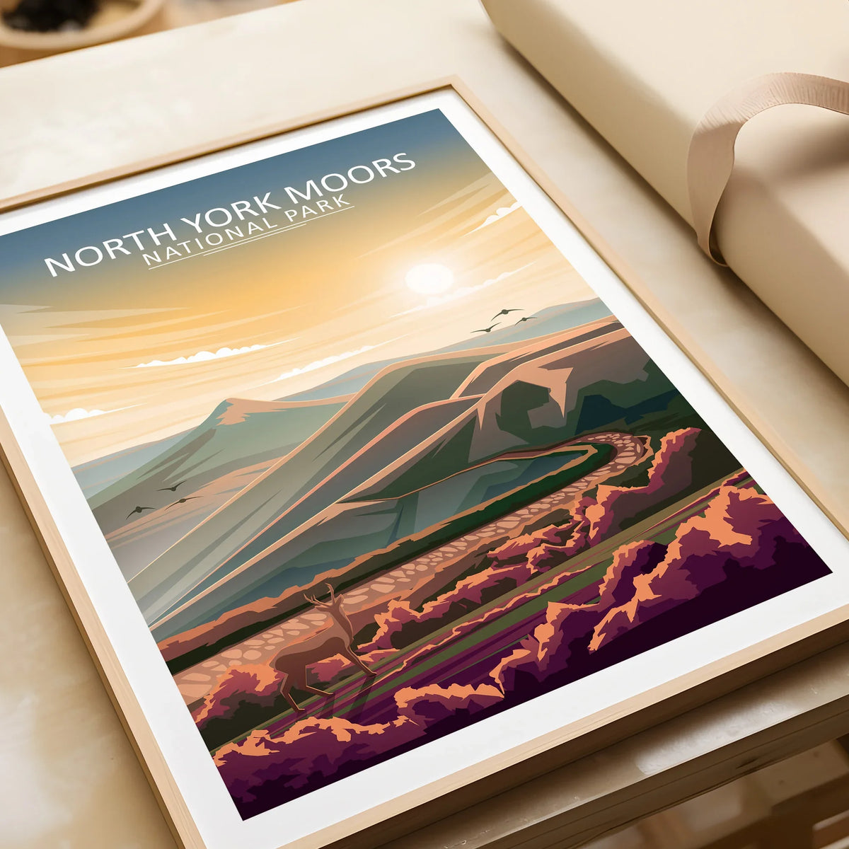 Framed North York Moors National Park art print with sunrise and landscape illustration.