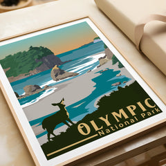 Framed Olympic National Park art print with coastal landscape and deer, unwrapped on a table.