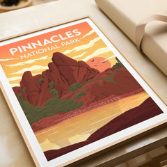 Framed Pinnacles National Park art print with vivid sunset landscape, unwrapped on table