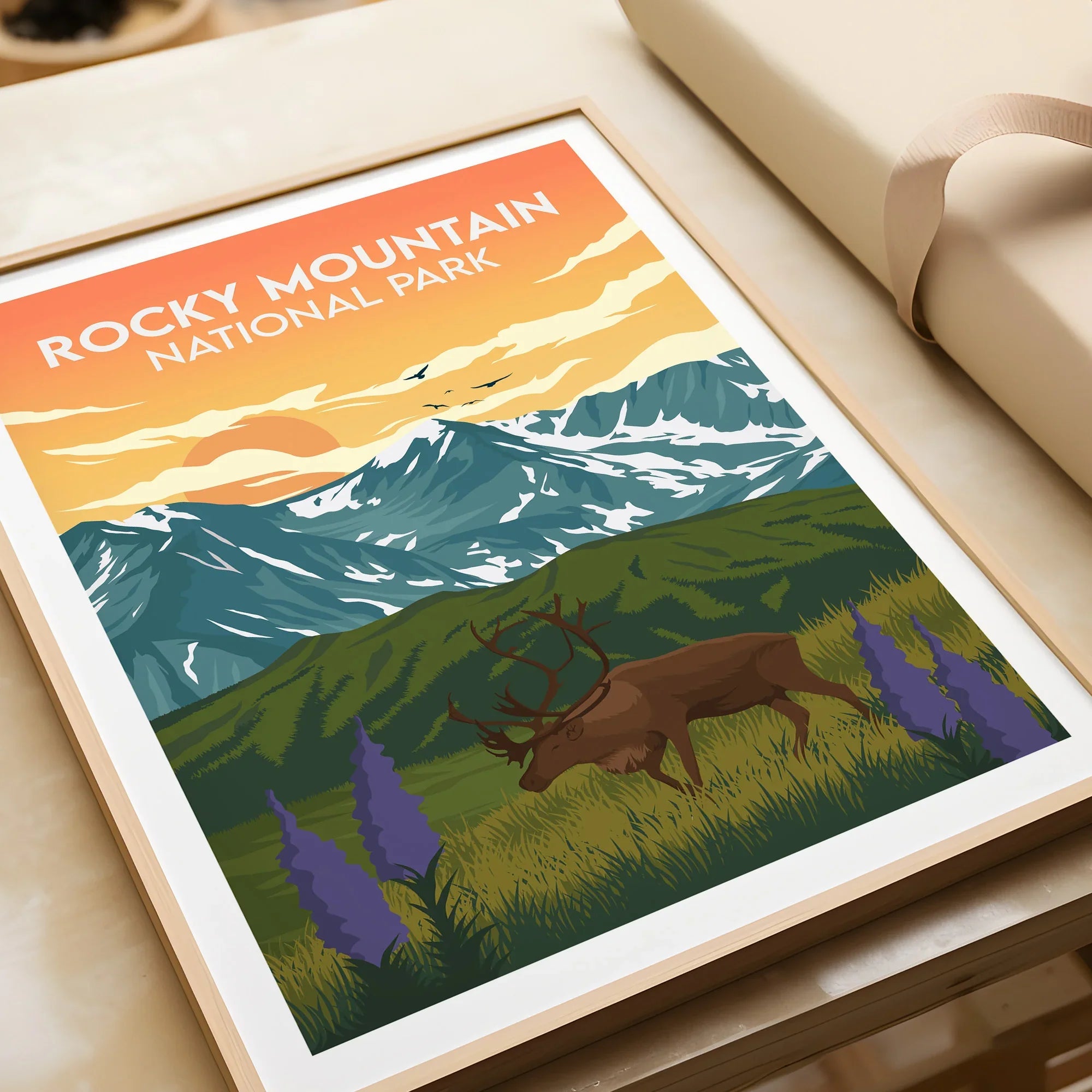 Framed Rocky Mountain National Park art print with elk, wildflowers, and mountain landscape.