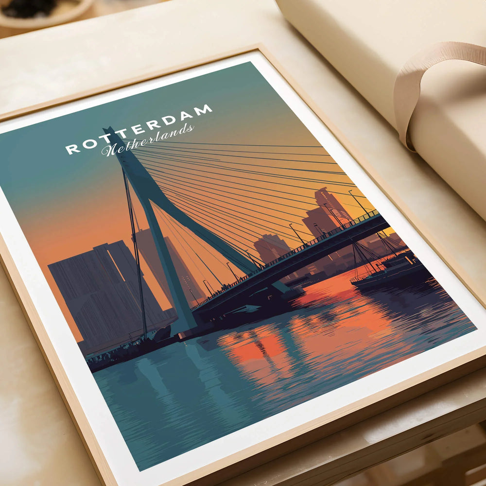 Rotterdam skyline art print with bridge at sunset in natural wood frame on table