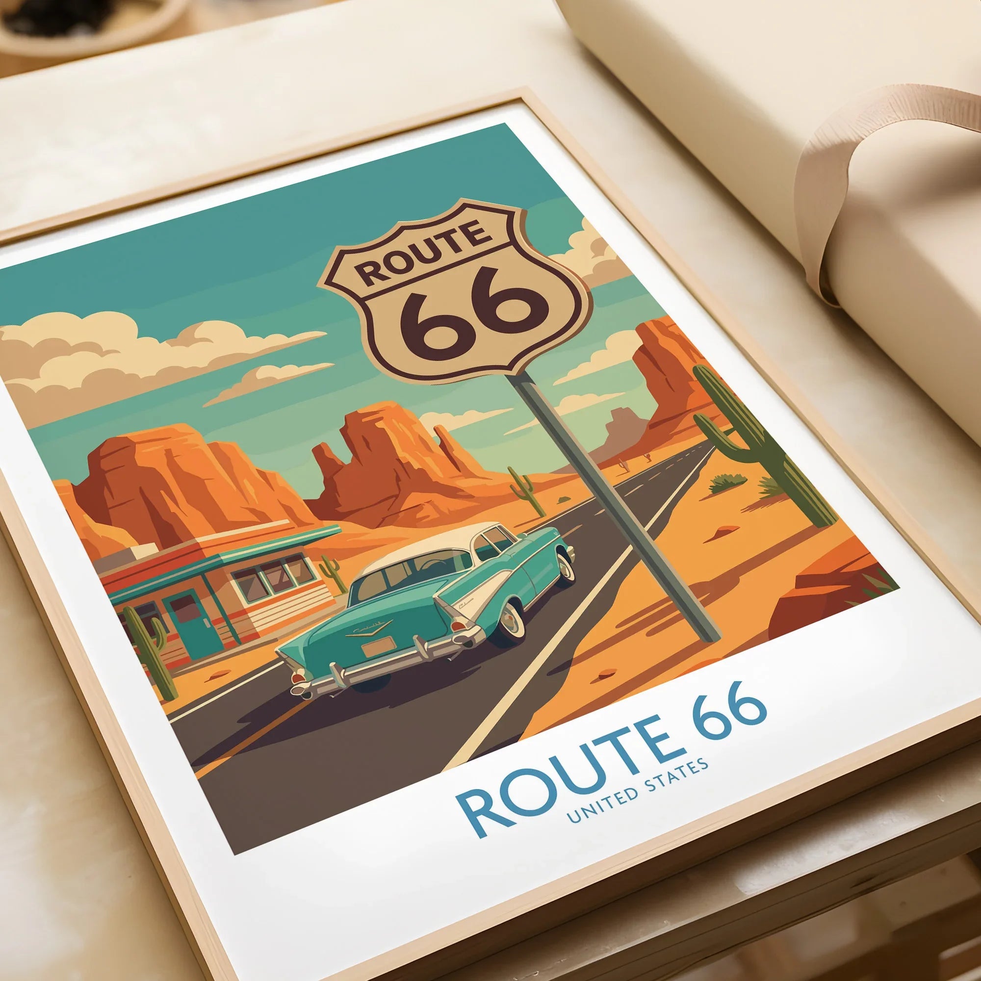 Framed Route 66 art print with vintage car and desert landscape, unwrapped as a gift.