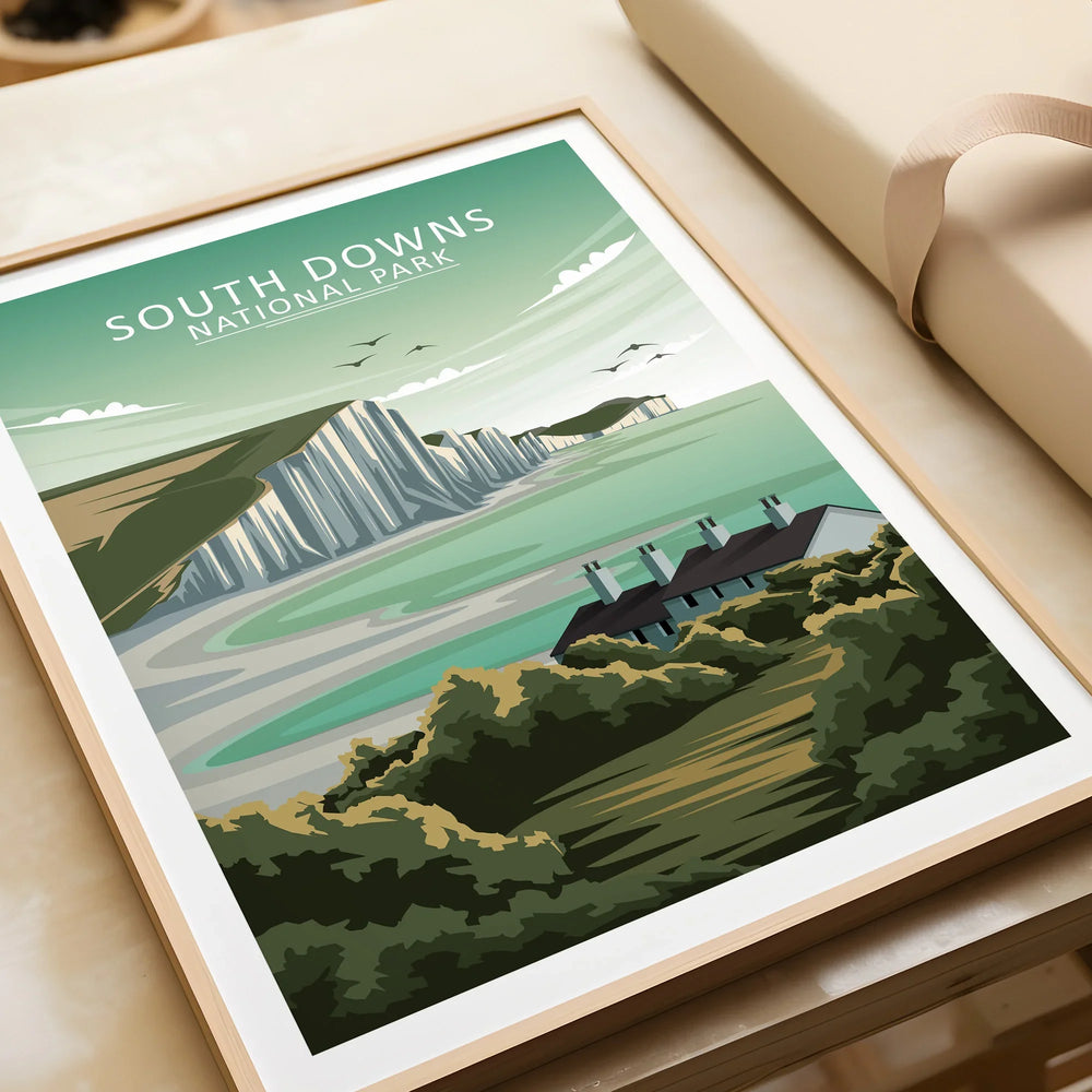 Framed South Downs National Park art print with coastal cliffs and cottages, unwrapped gift