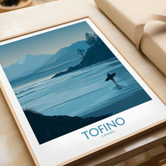 Tofino Canada Canvas Print | Misty Mountain & Shoreline Poster on a wooden table with a framed design.