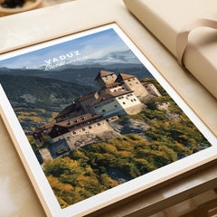 Vaduz Liechtenstein travel poster art print in a natural wood frame, unwrapped on table
