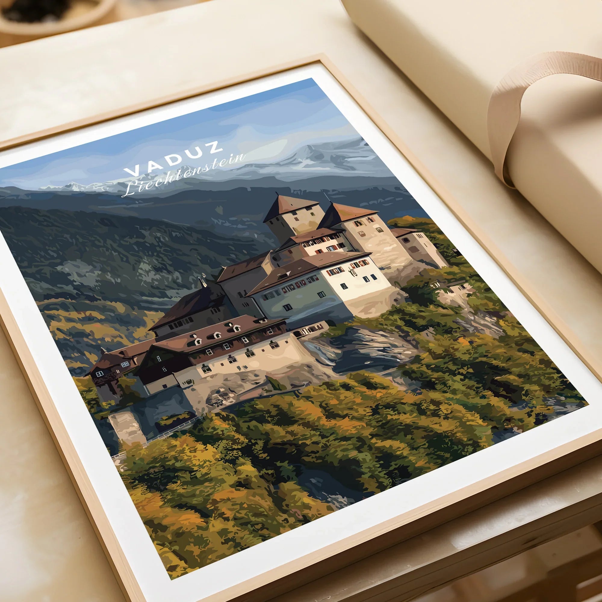 Vaduz Liechtenstein travel poster art print in a natural wood frame, unwrapped on table