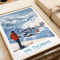 Val Thorens France Print showcasing a skier on slopes with snowy mountains and charming village backdrop.