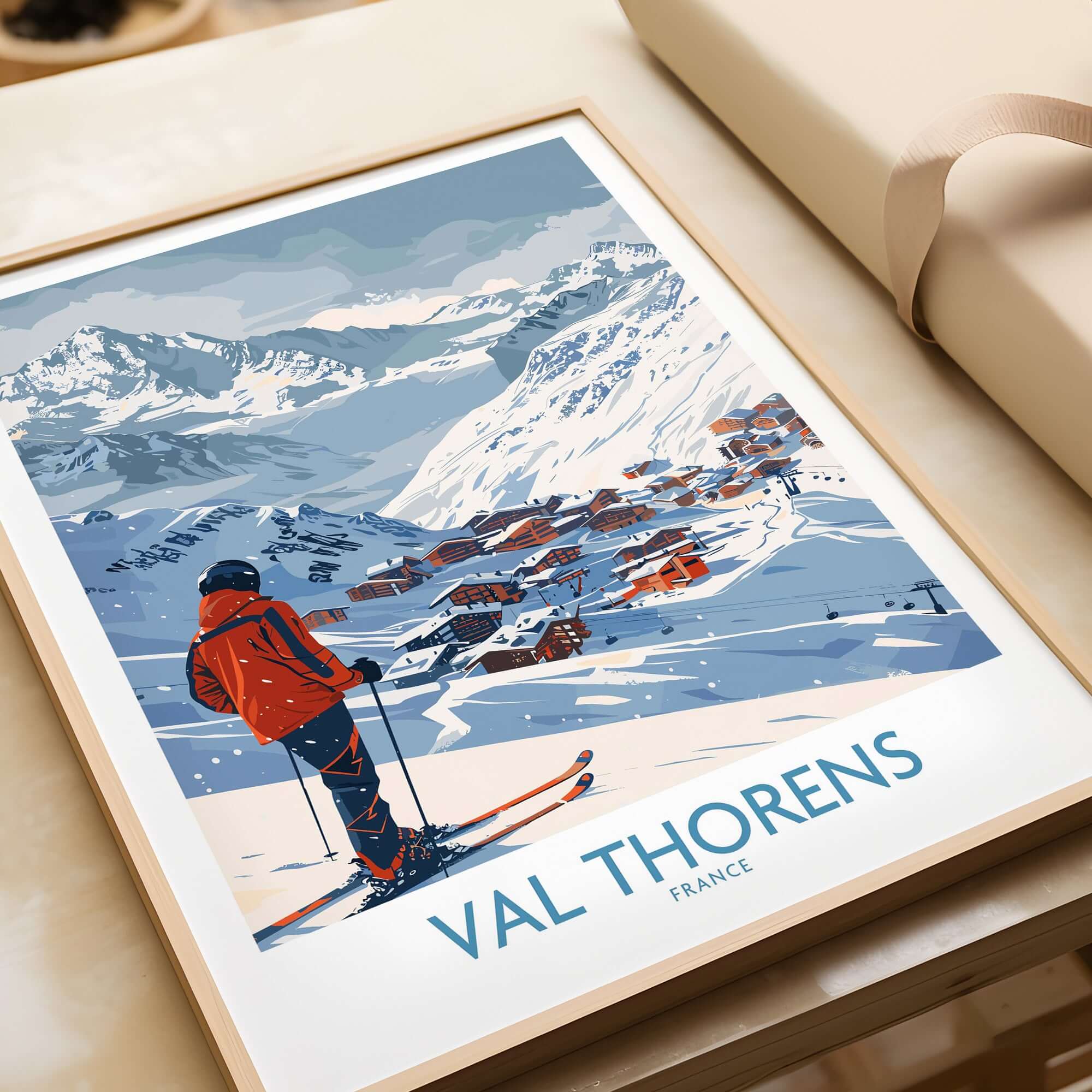 Val Thorens France Print showcasing a skier on slopes with snowy mountains and charming village backdrop.
