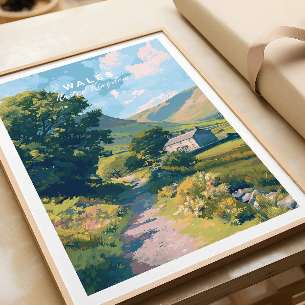 Framed Wales travel poster with countryside cottage and scenic landscape, unwrapped as a gift