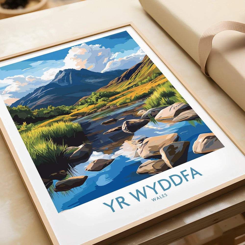 Framed Yr Wyddfa Wales art print featuring a colorful mountain and river landscape, unwrapped as a gift.