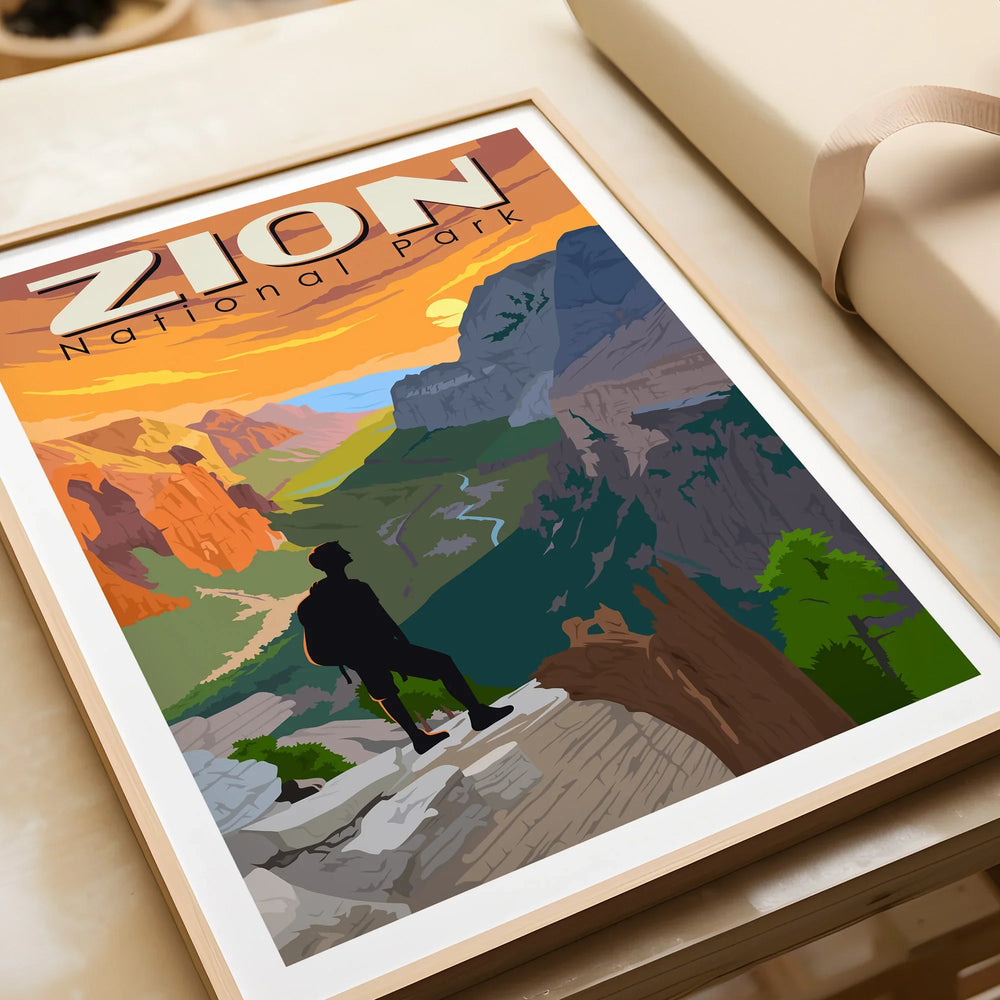 Framed Zion National Park art print with hiker silhouette and colorful canyon landscape