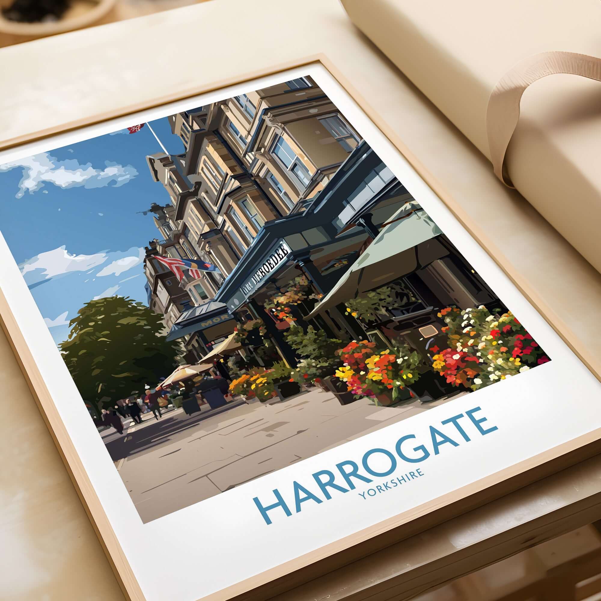 Harrogate Yorkshire Art Print | Floral Cafe Scene Poster featuring a vibrant café with flowers and blue skies.