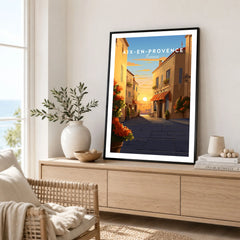 Aix-en-Provence Poster in a black frame displayed on an oak sideboard in a bright coastal living room