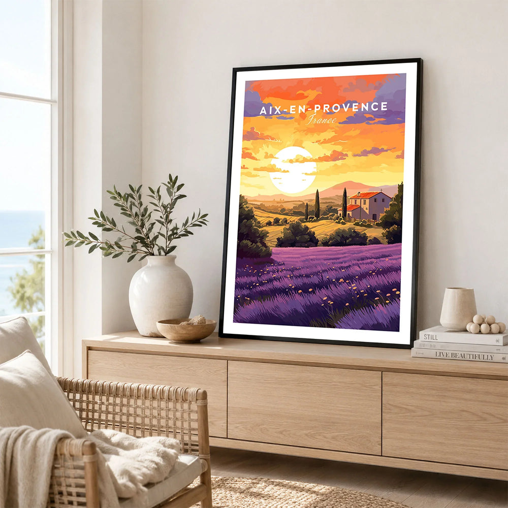 Aix-en-Provence Print in a black frame displayed on an oak sideboard in a bright coastal living room