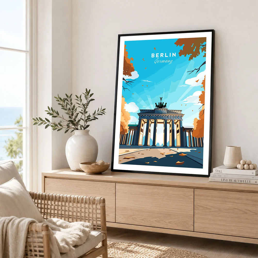 Berlin Poster Blue Sky in a black frame displayed on an oak sideboard in a bright coastal living room