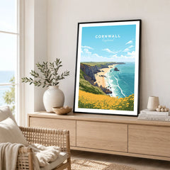 Cornwall Poster in a black frame displayed on an oak sideboard in a bright coastal living room