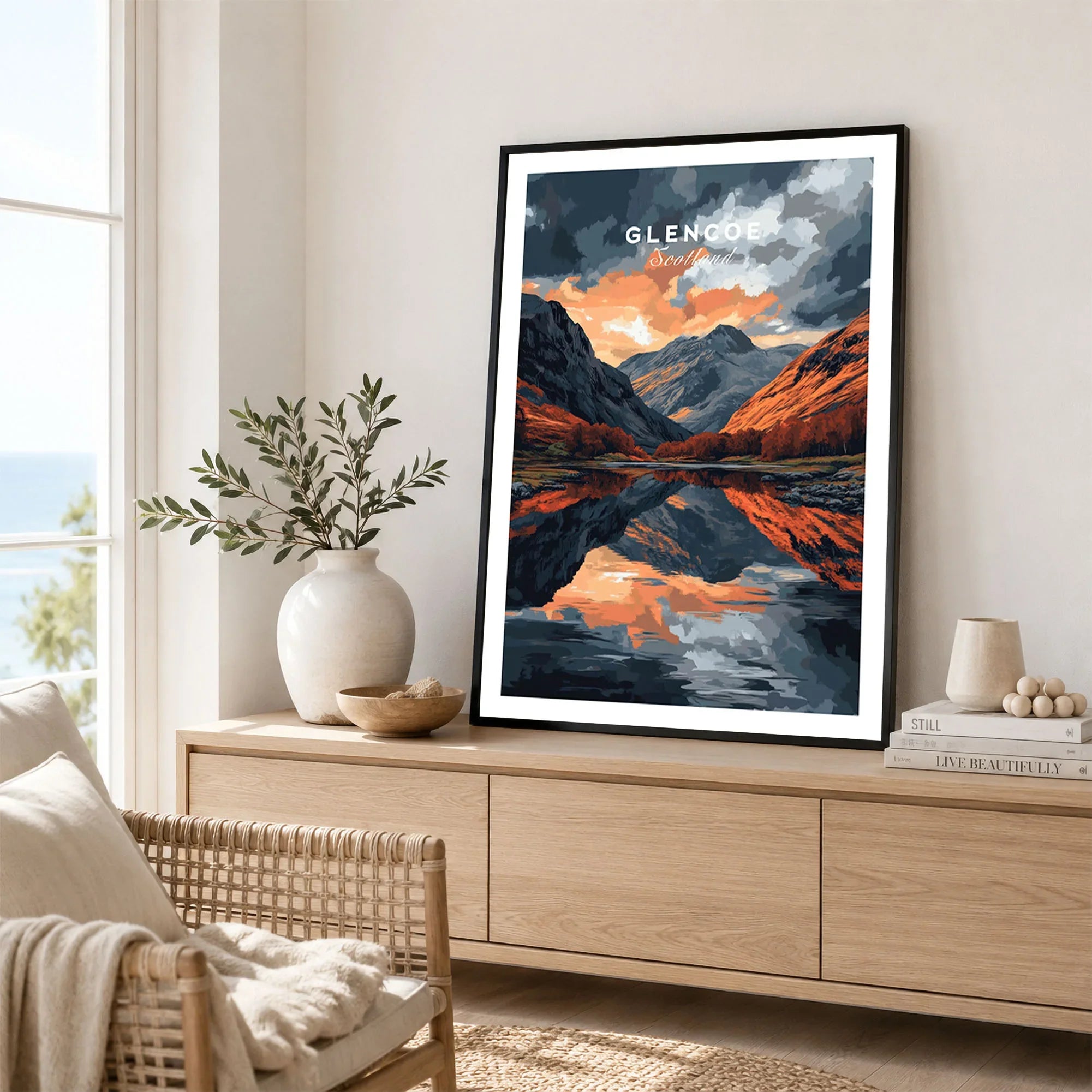 Glencoe Wall Art in a black frame displayed on an oak sideboard in a bright coastal living room
