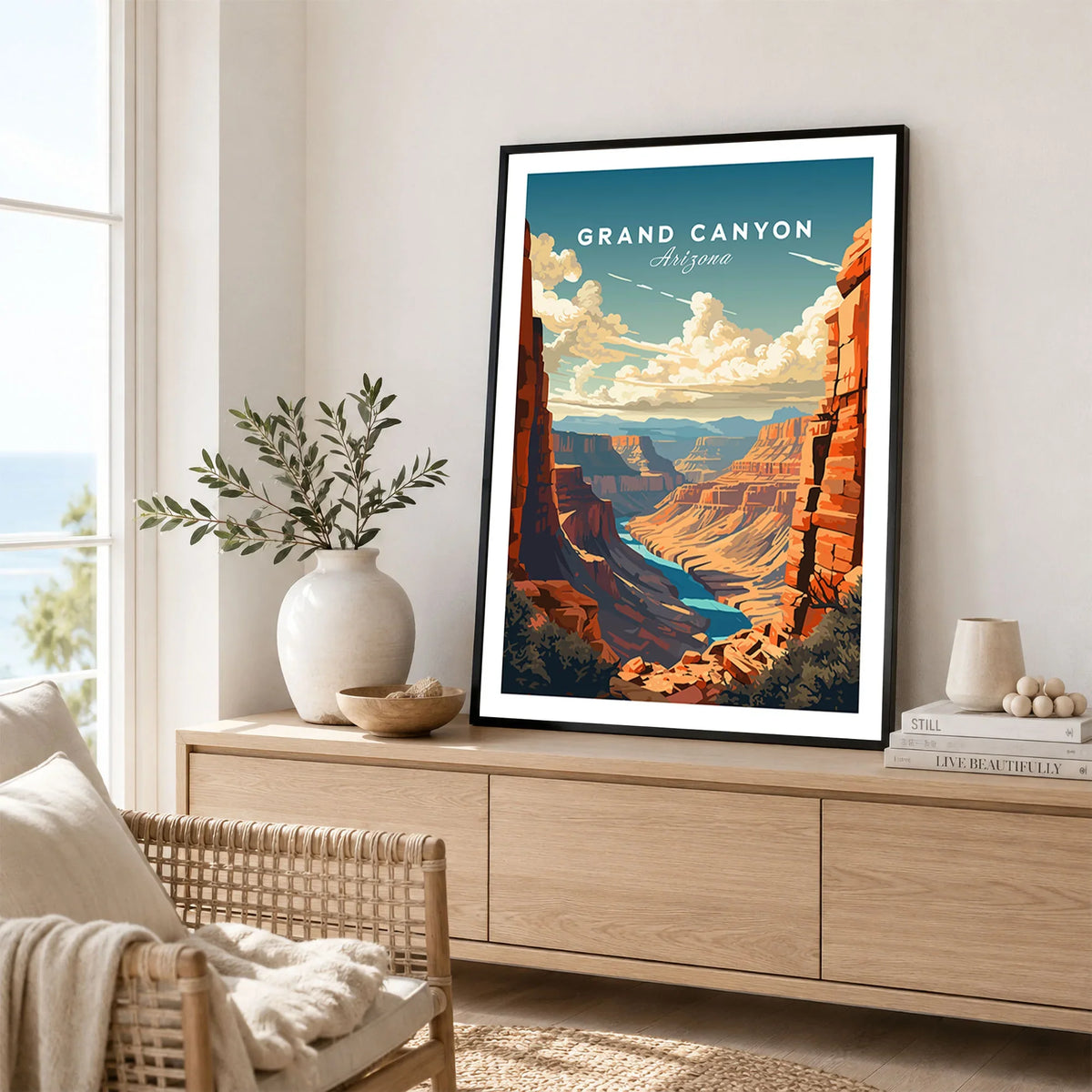Grand Canyon Poster in a black frame displayed on an oak sideboard in a bright coastal living room