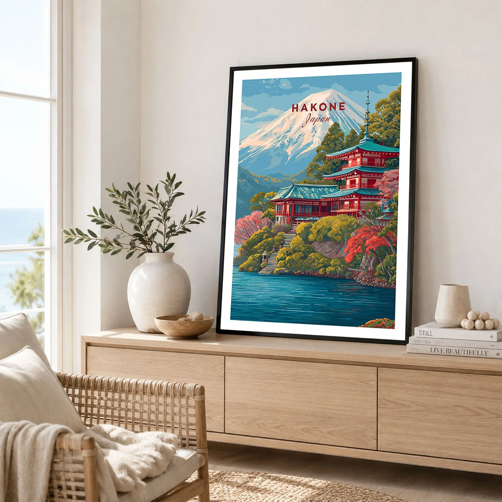 Hakone Japan Print Historic Shrine Lake Ashi Art - Mount Fuji Pagoda Poster in a black frame displayed on an oak sideboard in a bright coastal living room