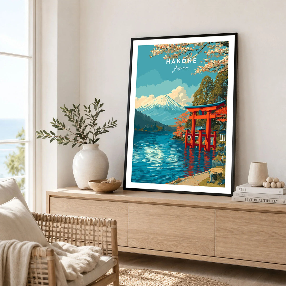 HakonePrint Japan Peace Shrine Torii Artwork - Mount Fuji Lake Ashi Poster in a black frame displayed on an oak sideboard in a bright coastal living room