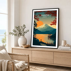 Hakone Japan Torii Gate Sunset Poster - Mount Fuji Lake Scene Print in a black frame displayed on an oak sideboard in a bright coastal living room