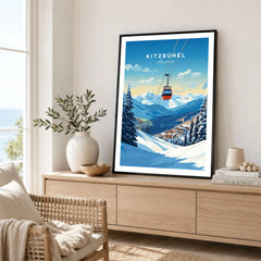 Kitzbuhel Art Print in a black frame displayed on an oak sideboard in a bright coastal living room