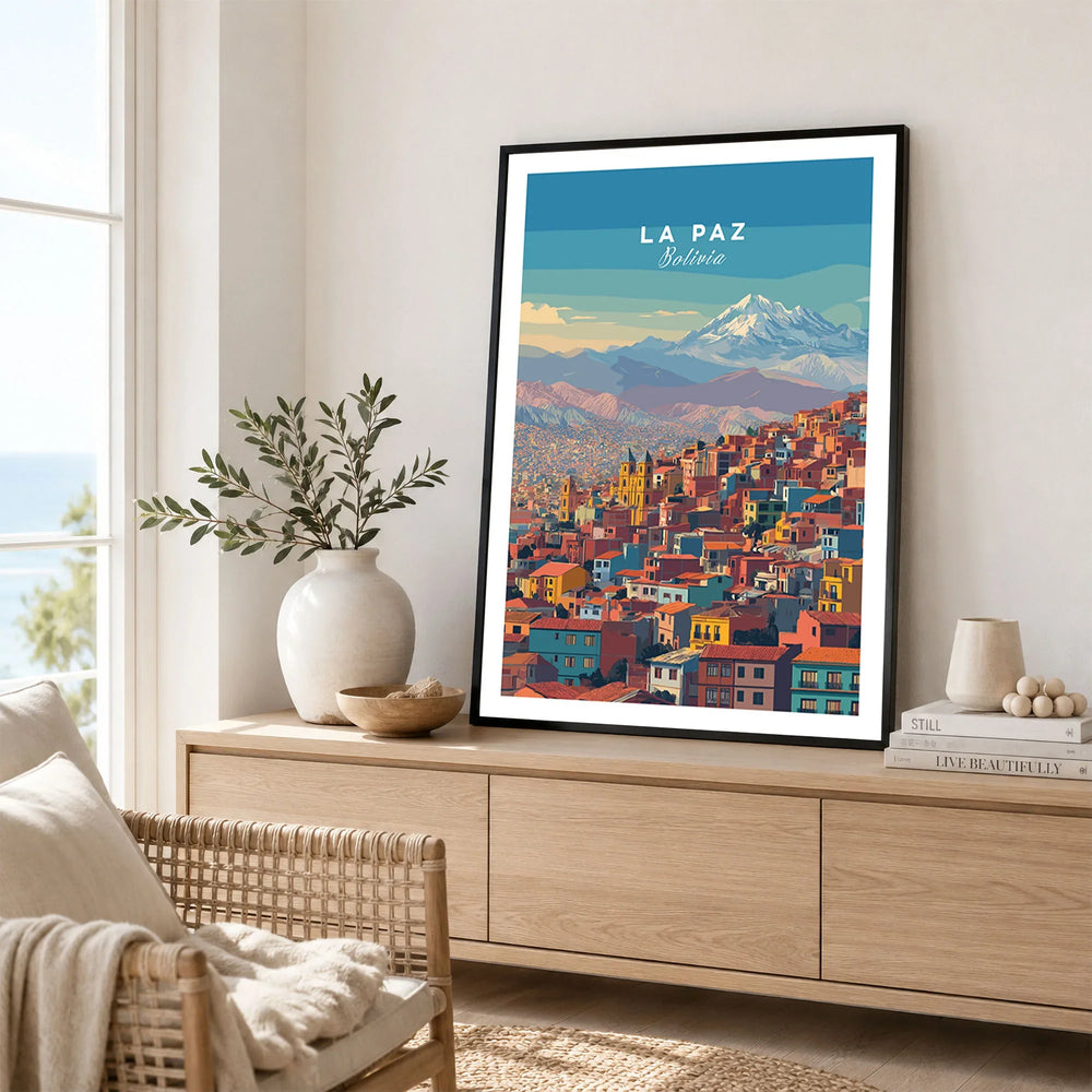 La Paz Bolivia Andes Mountain City Print - Travel Poster in a black frame displayed on an oak sideboard in a bright coastal living room