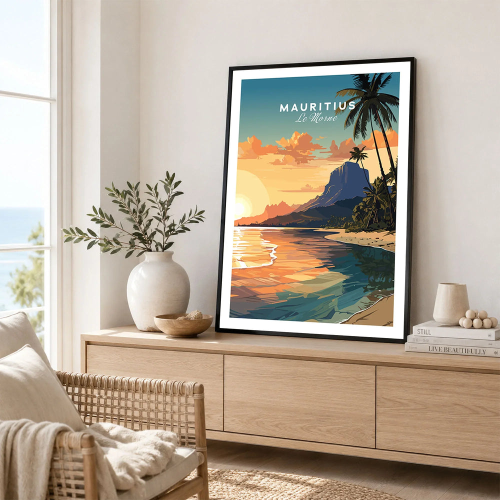 Le Morne Mauritius Poster in a black frame displayed on an oak sideboard in a bright coastal living room