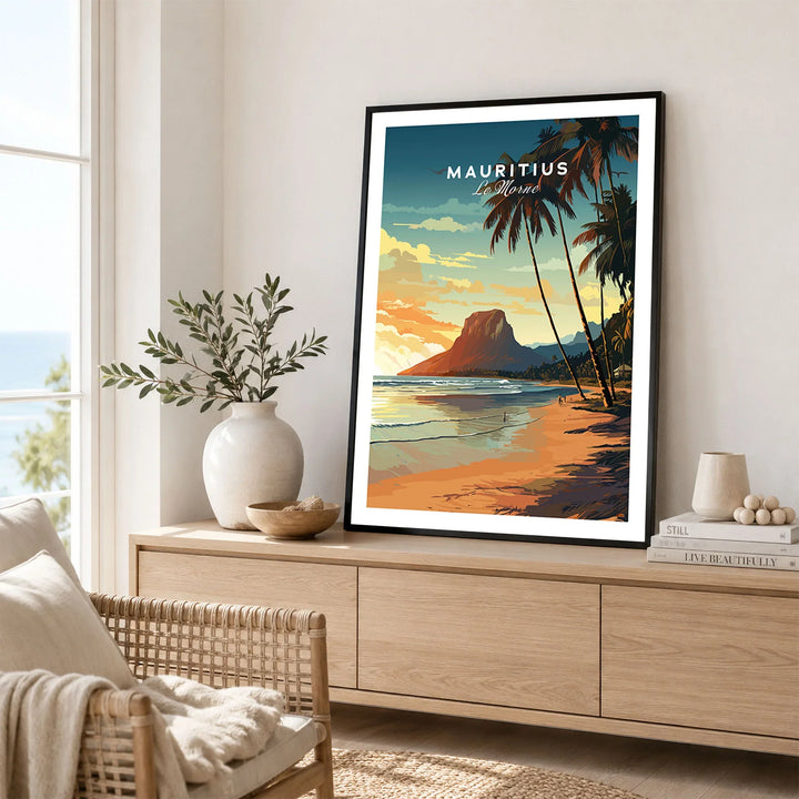 Mauritius Le Morne Poster in a black frame displayed on an oak sideboard in a bright coastal living room