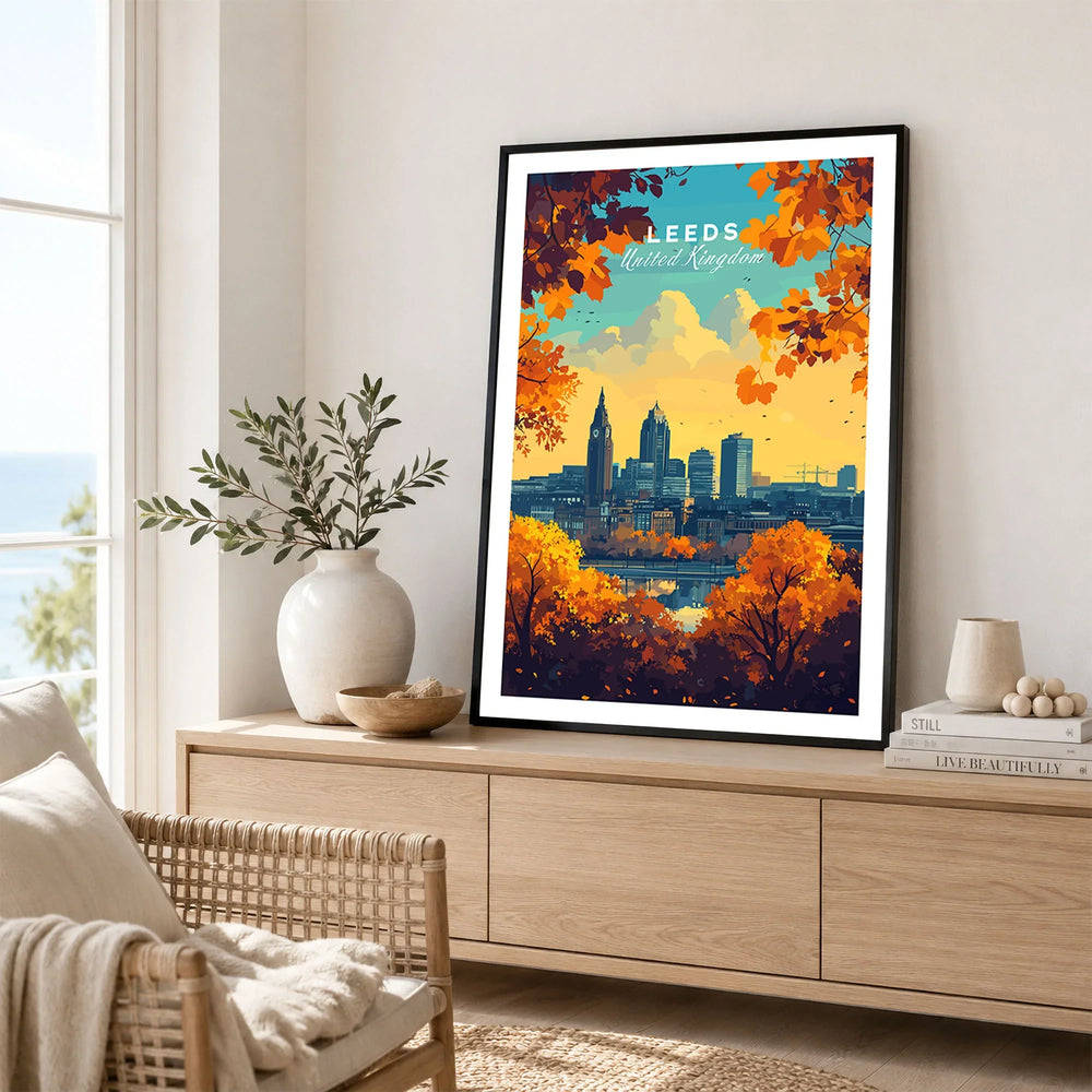 Leeds Wall Art Print - United Kingdom Travel Poster in a black frame displayed on an oak sideboard in a bright coastal living room