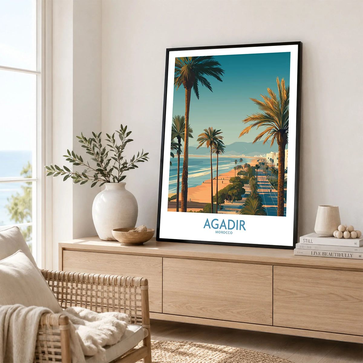 Agadir Morocco Wall Art Canvas in a black frame displayed on an oak sideboard in a bright coastal living room