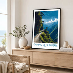 Camino de la Muerte Bolivia Cliff Road Wall Art — the Yungas cliff road curving along a jungle mountainside above the Bolivian Andes, shown as framed artwork living room lifestyle setting