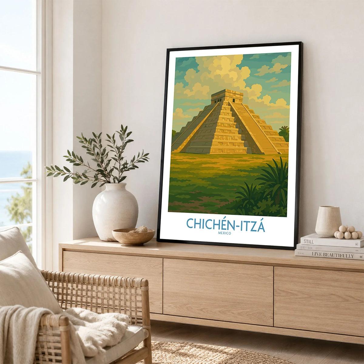 Mexico Mayan Pyramid Chichén Itzá Travel Poster El Castillo Landscape Print Wall Art in a black frame displayed on an oak sideboard in a bright coastal living room