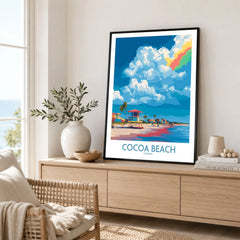 Cocoa Beach Rainbow Cloud Poster - Florida Travel Decor in a black frame displayed on an oak sideboard in a bright coastal living room
