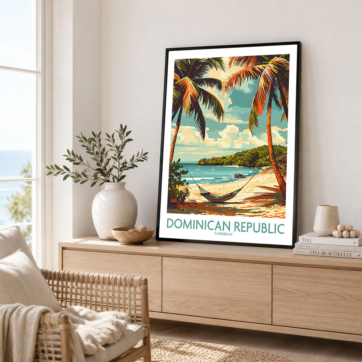 Dominican Republic Print in a black frame displayed on an oak sideboard in a bright coastal living room
