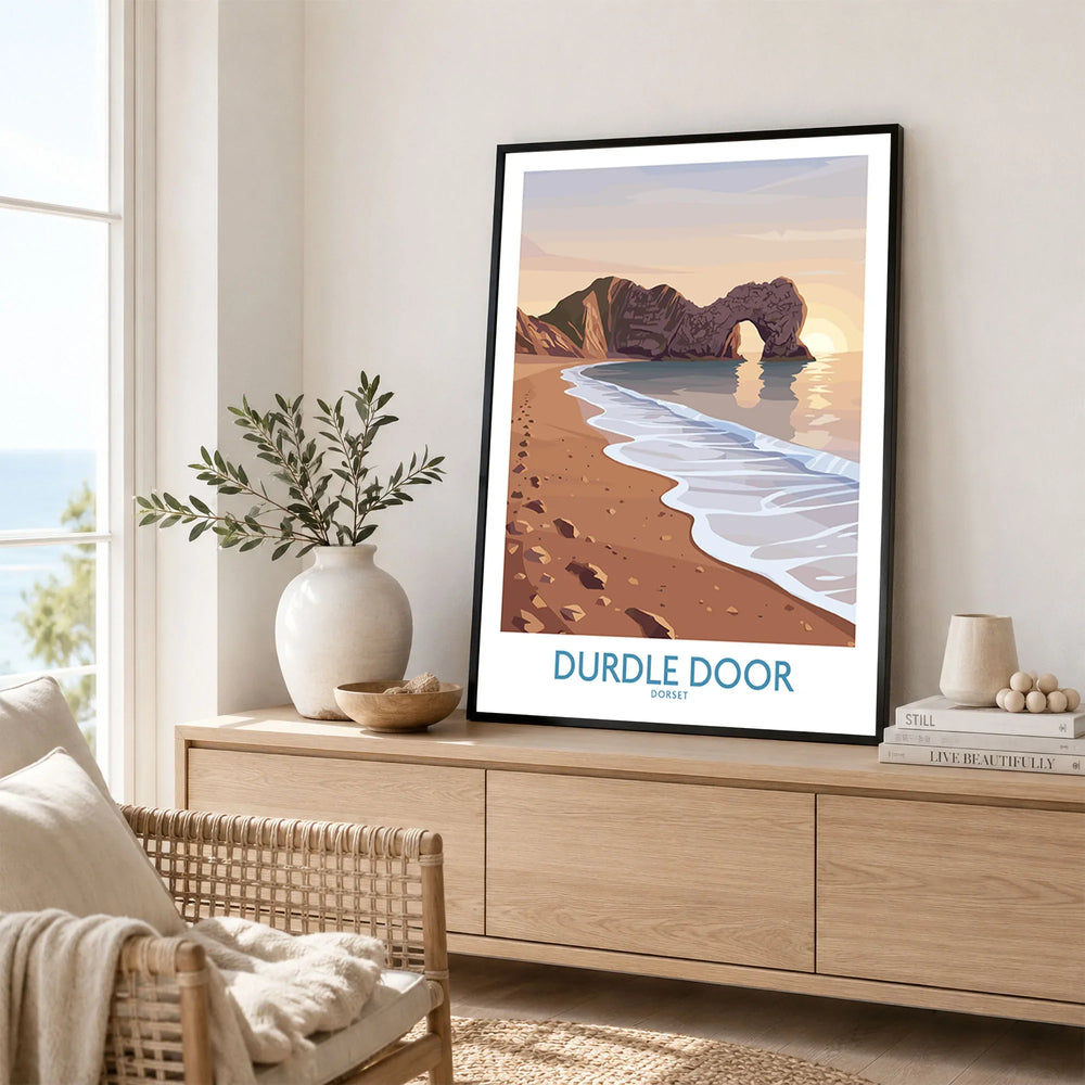 Durdle Door Dorset Wall Art – Canvas Poster in a black frame displayed on an oak sideboard in a bright coastal living room
