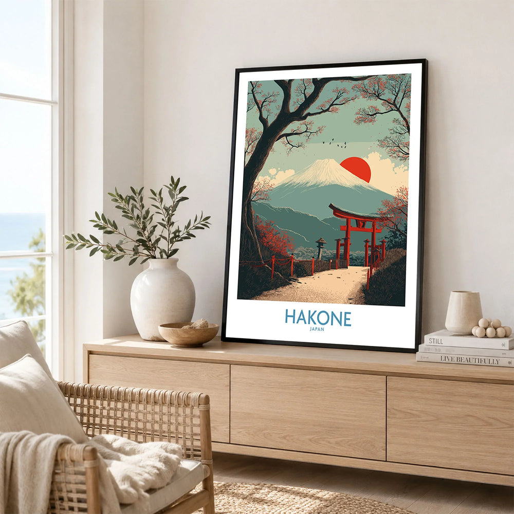 Hakone Japan Peace Gate Shrine Wall Art - Autumn Cherry Blossom Decor in a black frame displayed on an oak sideboard in a bright coastal living room