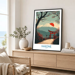 Hakone Japan Peace Gate Shrine Wall Art - Autumn Cherry Blossom Decor in a black frame displayed on an oak sideboard in a bright coastal living room