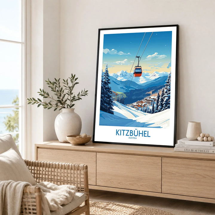 Kitzbuhel Wall Art Print in a black frame displayed on an oak sideboard in a bright coastal living room