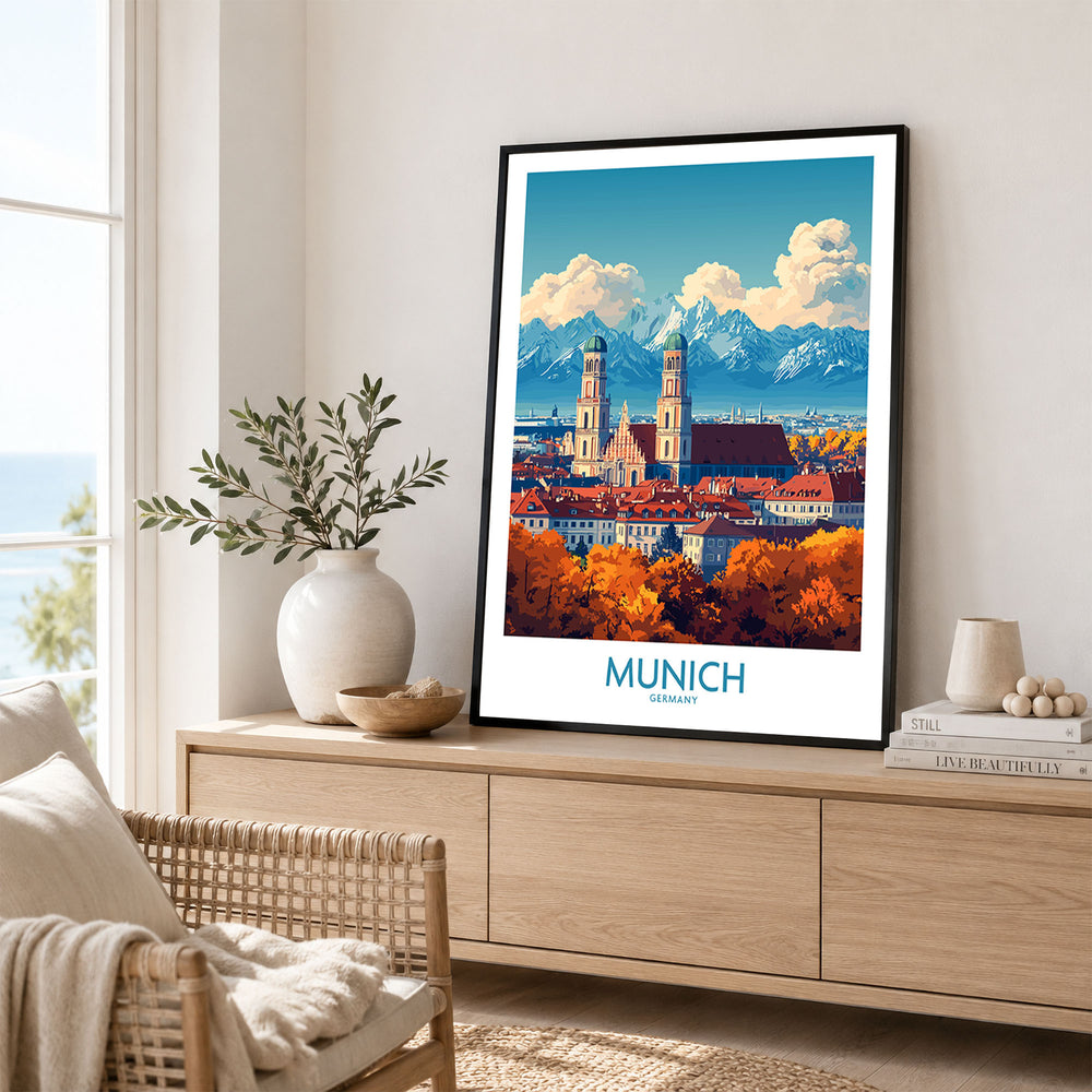 Munich Travel Poster in a black frame displayed on an oak sideboard in a bright coastal living room
