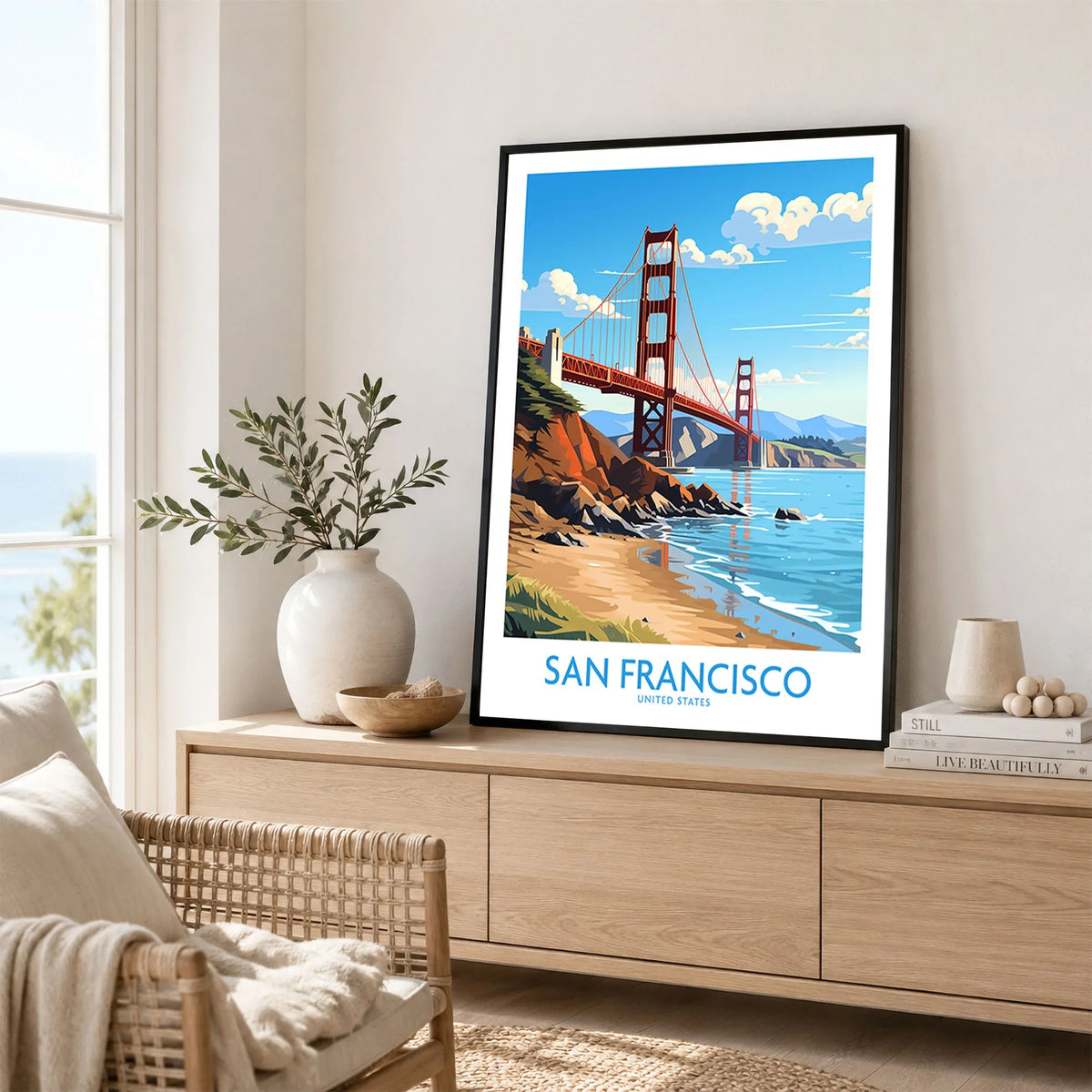 San Francisco Poster in a black frame displayed on an oak sideboard in a bright coastal living room