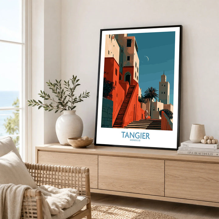 Tangier Morocco Crescent Moon Wall Art — coral kasbah steps climbing towards a minaret under a crescent moon, shown as framed artwork living room lifestyle setting