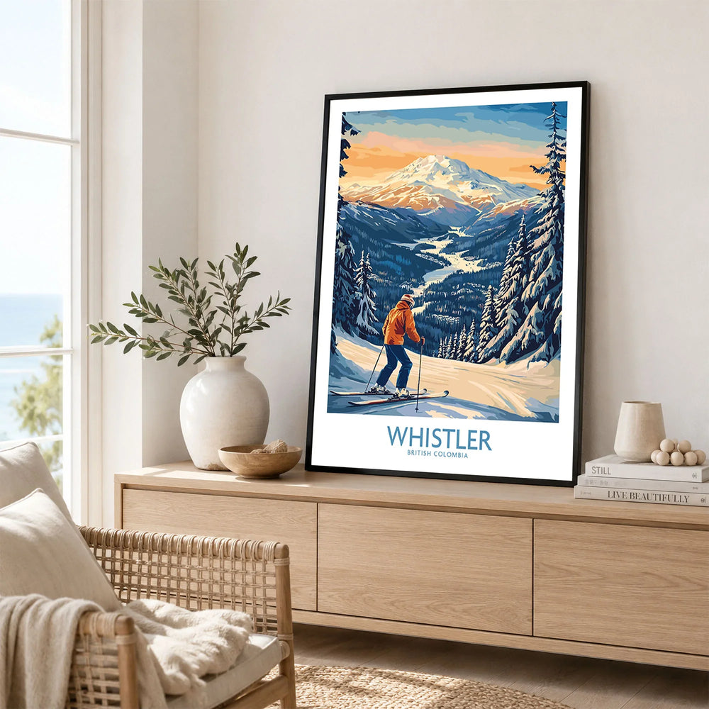 Whistler Ski Print - British Columbia in a black frame displayed on an oak sideboard in a bright coastal living room